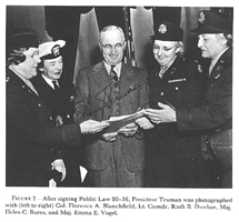 After signing Public Law 80-36, President Truman was photographed with (left to right) Col. Florence A. Blanchfield, Lt. Comdr. Ruth B. Dunbar, Maj. Helen C. Burns, and Maj. Emma E. Vogel.