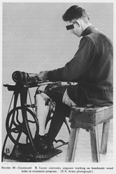 FIGURE 20. Continued. B. Lower extremity amputee working on handmade wood lathe   in treatment program. (U.S. Army photograph.)