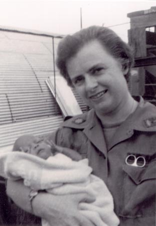 Major Mary C. Quinn, ANC, holding Baby Barbara, a baby born at the 24th EvacuationHospital, Long Binh, South Vietnam12 November 1967